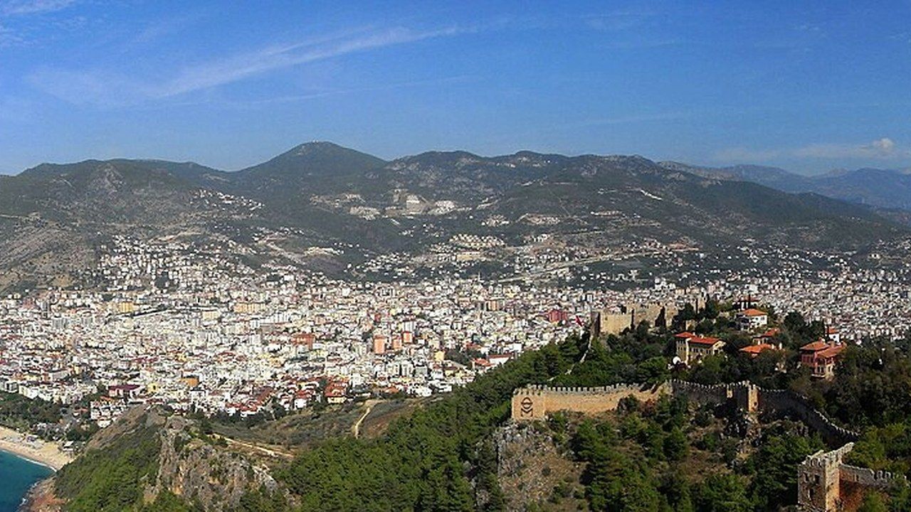 Panoramic view of Alanya coastline and city beneath the Taurus Mountains