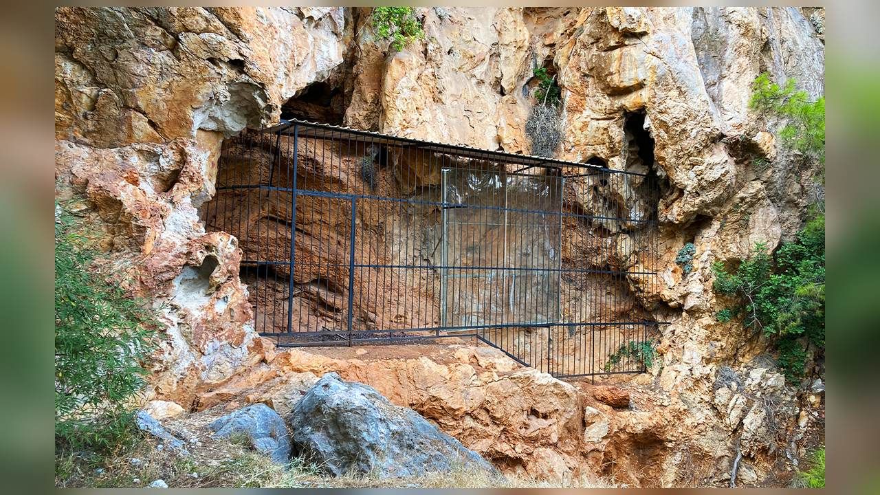 Protected entrance of the prehistoric Beldibi Cave near Kemer