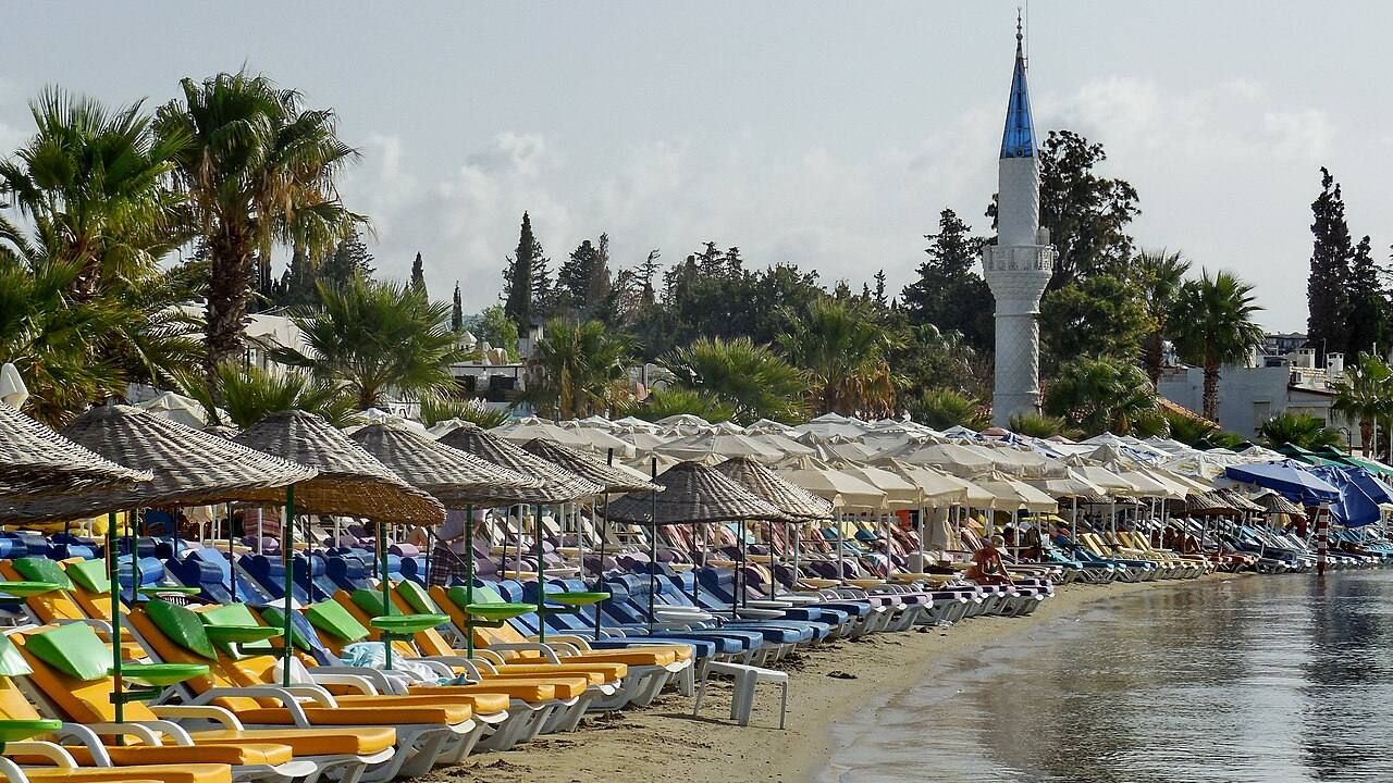 Colorful sun loungers and waterfront scenery at Bitez Beach in Bodrum.