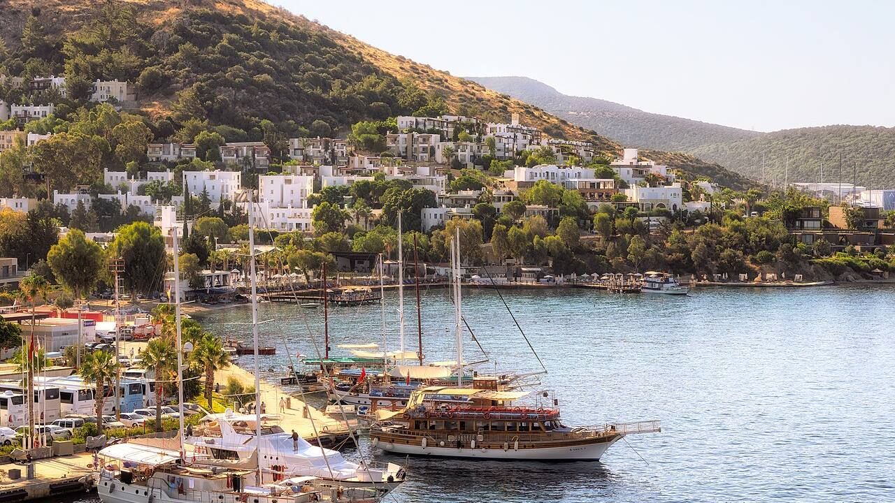 Panoramic view of Bodrum harbor, marina and white hillside houses