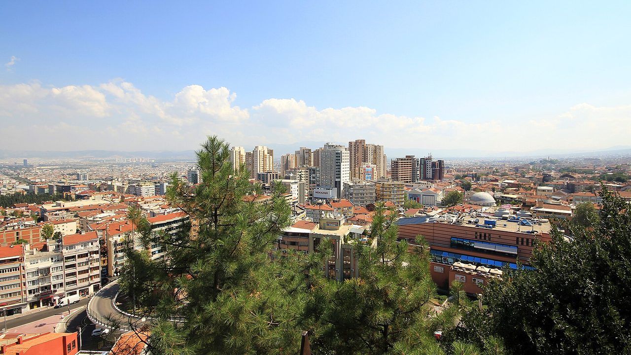 Wide panoramic city view of Bursa with mountains in the background