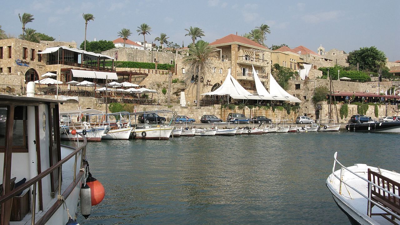 Fishing boats and historic stone waterfront at Byblos Old Harbor