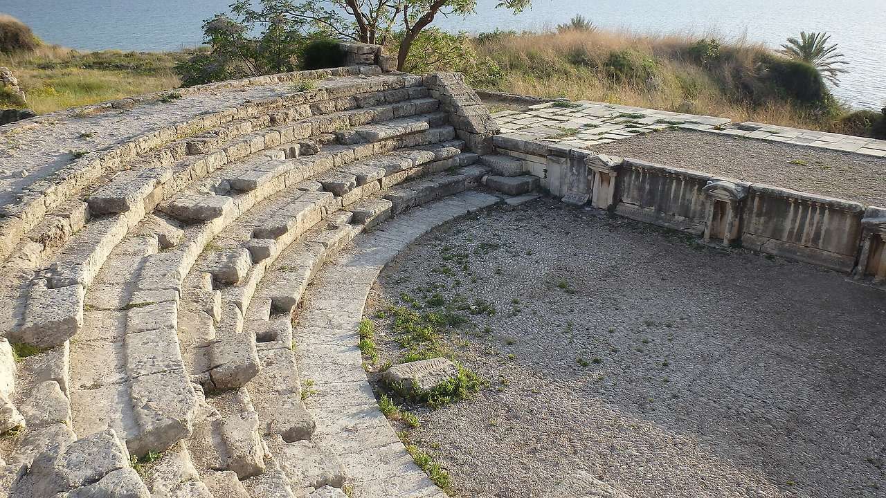 Semicircular stone seating of the Roman Theater in Byblos overlooking the Mediterranean