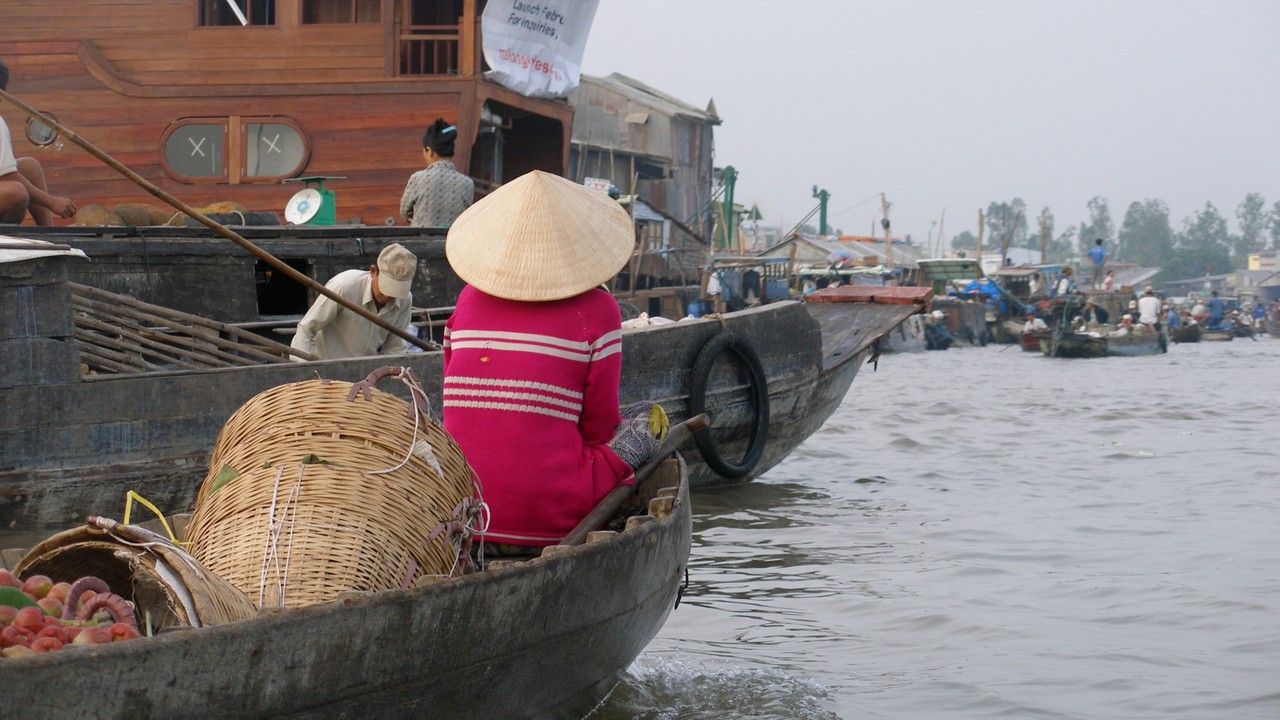 Traditional boats at Cai Rang floating market in Can Tho Mekong Delta Vietnam