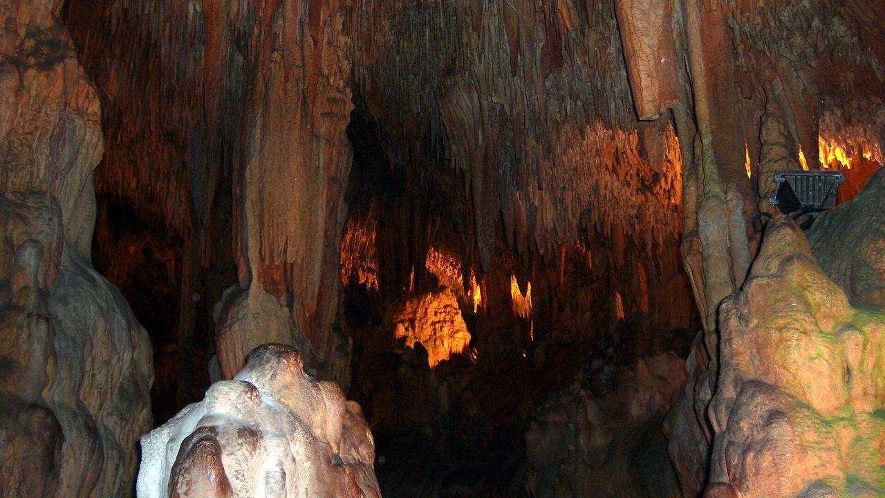 talactites and illuminated rock formations inside Damlataş Cave