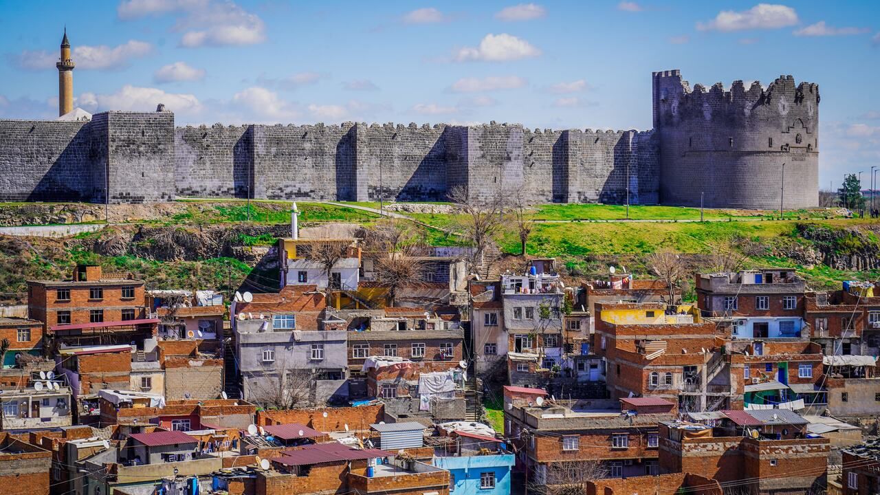 Panoramic view of the historic basalt city walls of Diyarbakir rising above the surrounding urban landscape.Panoramic view of the historic basalt city walls of Diyarbakir rising above the surrounding urban landscape.