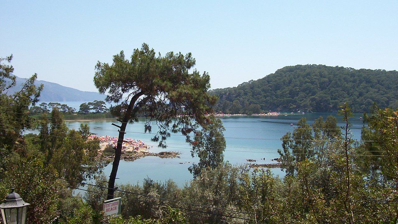 Blue Lagoon at Ölüdeniz surrounded by pine-covered hills near Fethiye