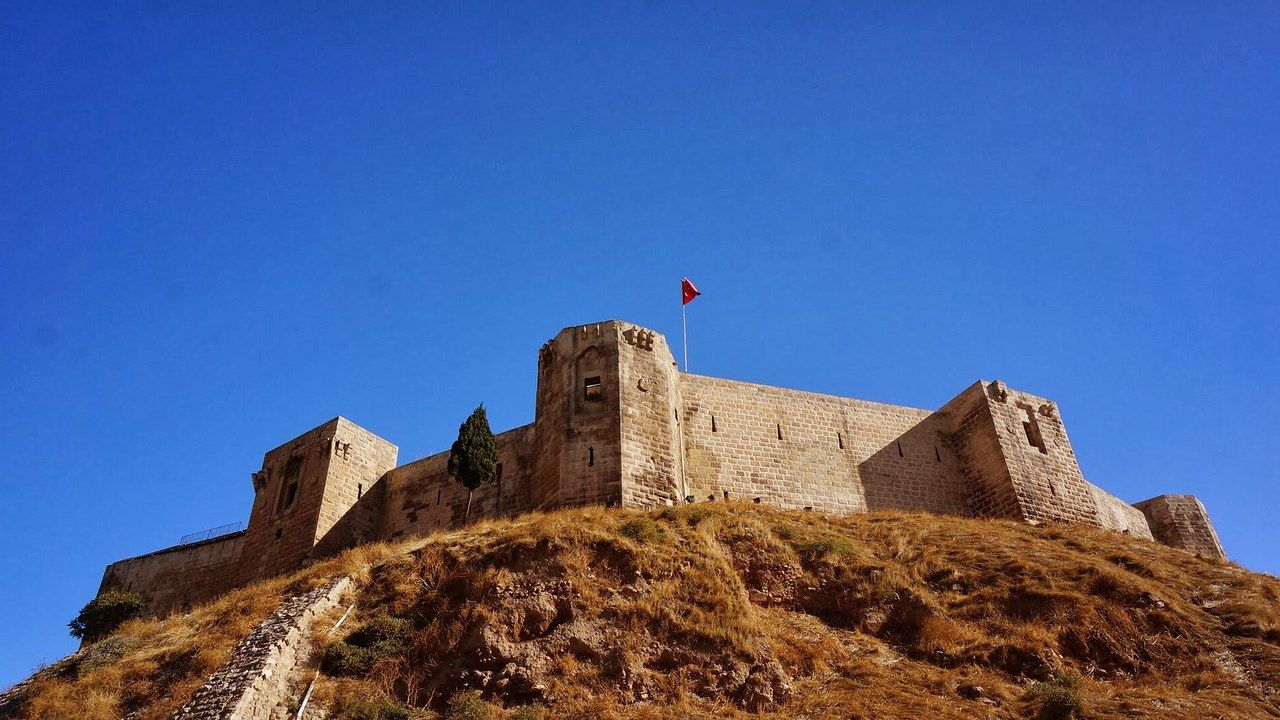 Gaziantep Castle rising above the city under a deep blue sky