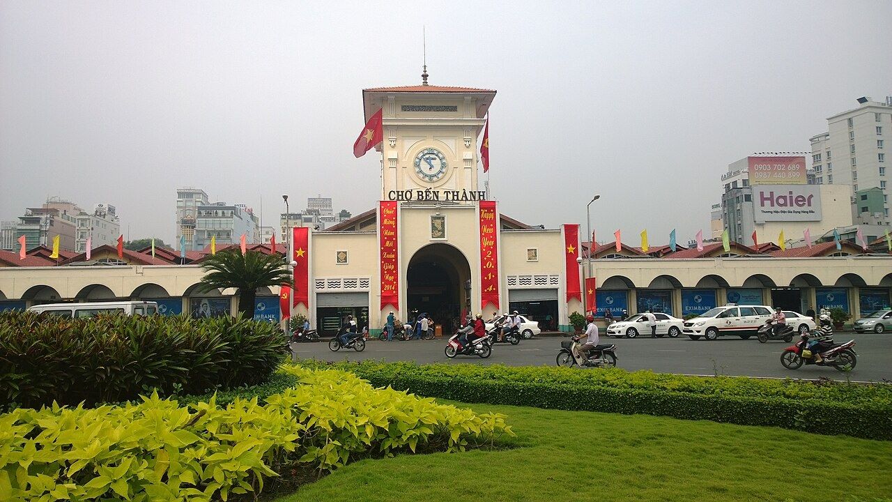 Ben Thanh Market and busy city streets in Ho Chi Minh City Vietnam
