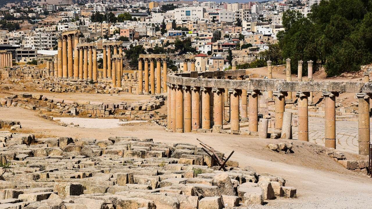 Wide view of the ancient Roman colonnade and archaeological ruins of Jerash, Jordan