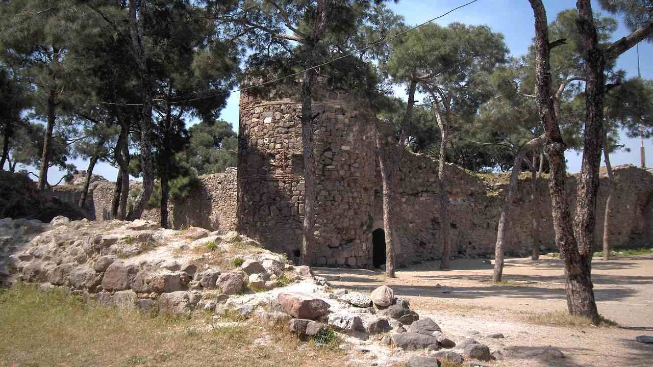 Historic stone walls and towers of Kadifekale Castle in Izmir, Turkey.