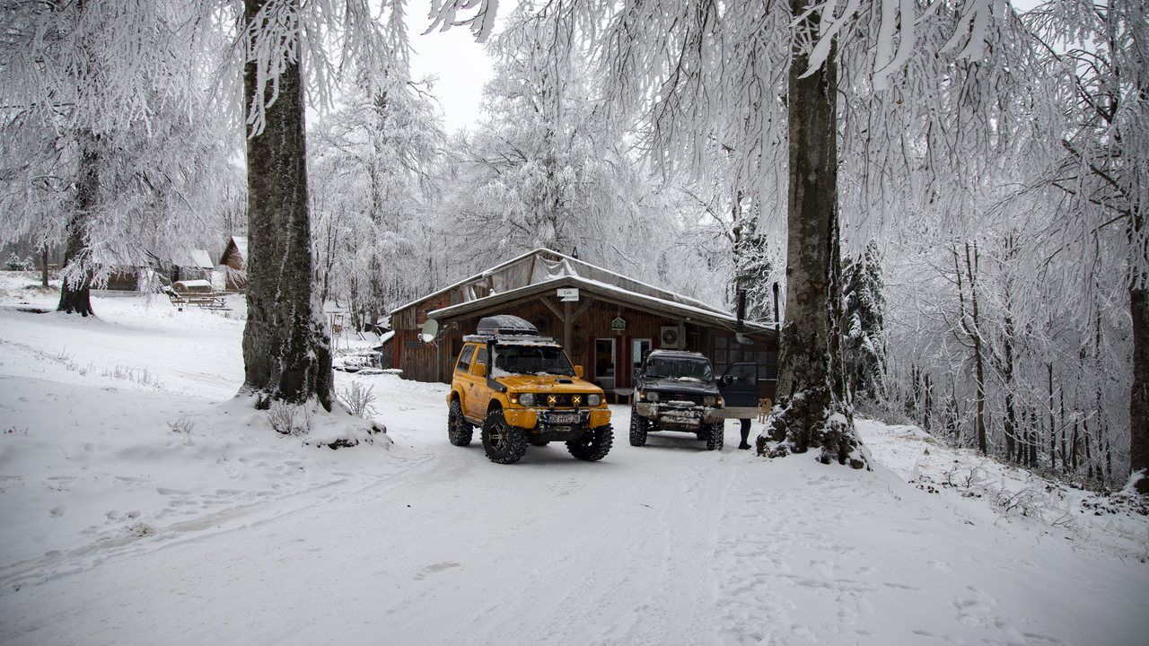 Snow-covered forest and mountain lodge at Kuzuyayla in Kartepe