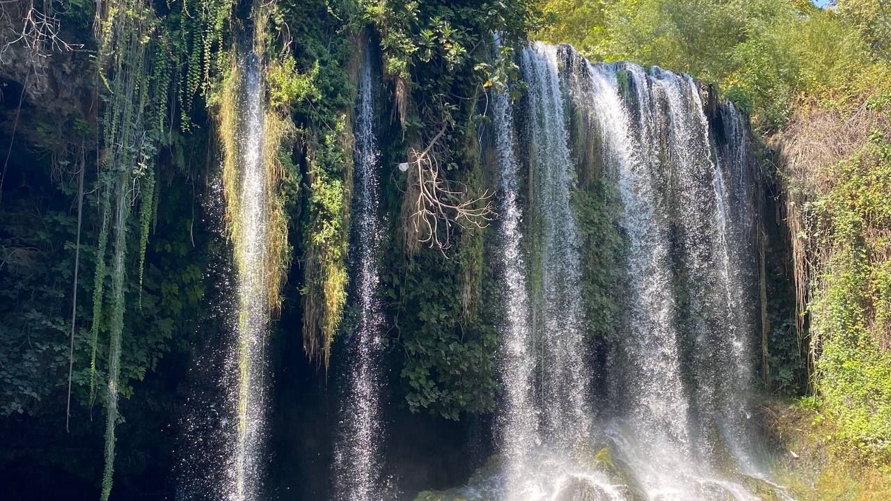 Kurşunlu Waterfall surrounded by lush greenery in Antalya, Turkey