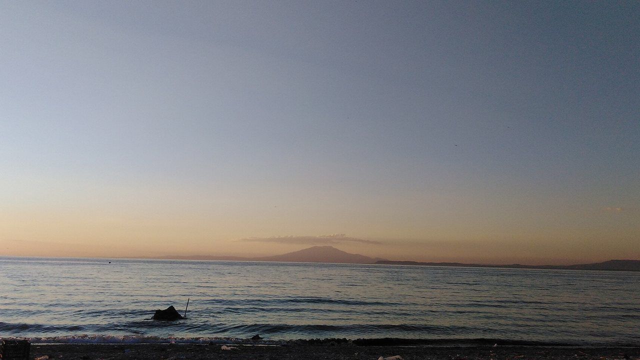 Wide view of Lake Van with Mount Süphan rising beyond the blue water