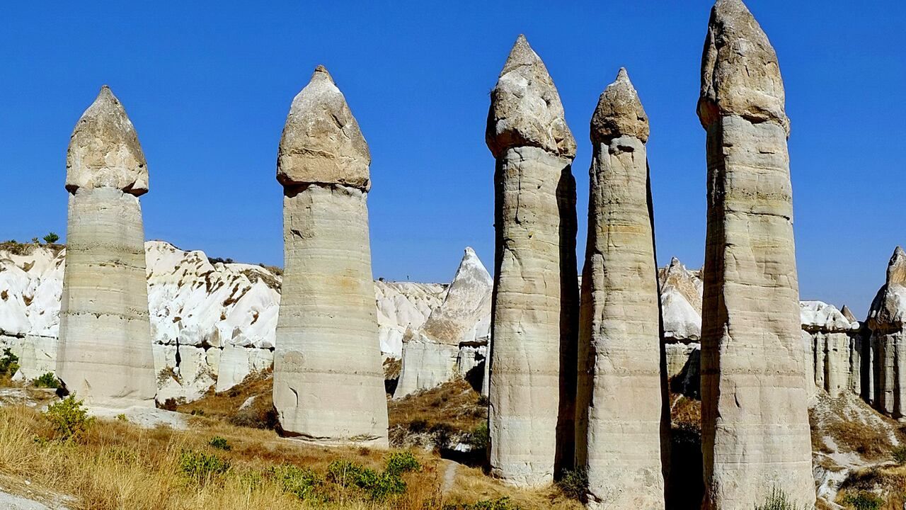 Wide view of the iconic fairy chimneys in Love Valley, Cappadocia, Türkiye