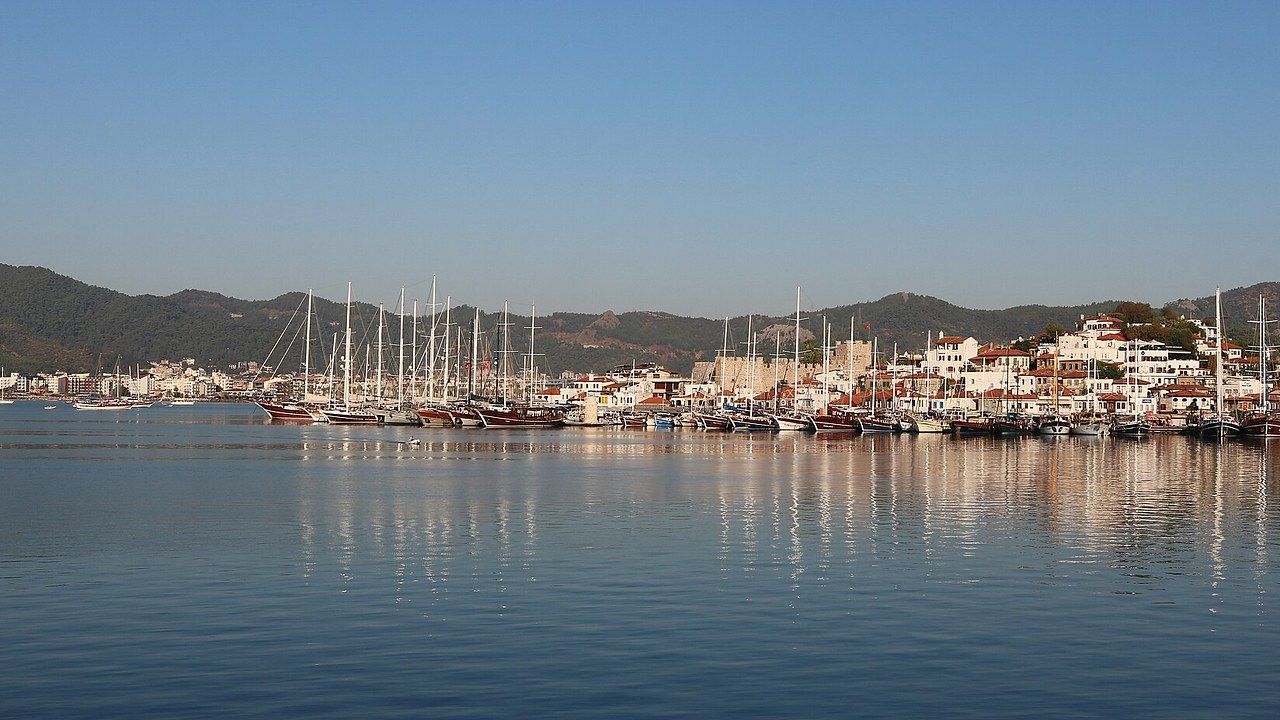 Marmaris marina filled with yachts against forested mountains