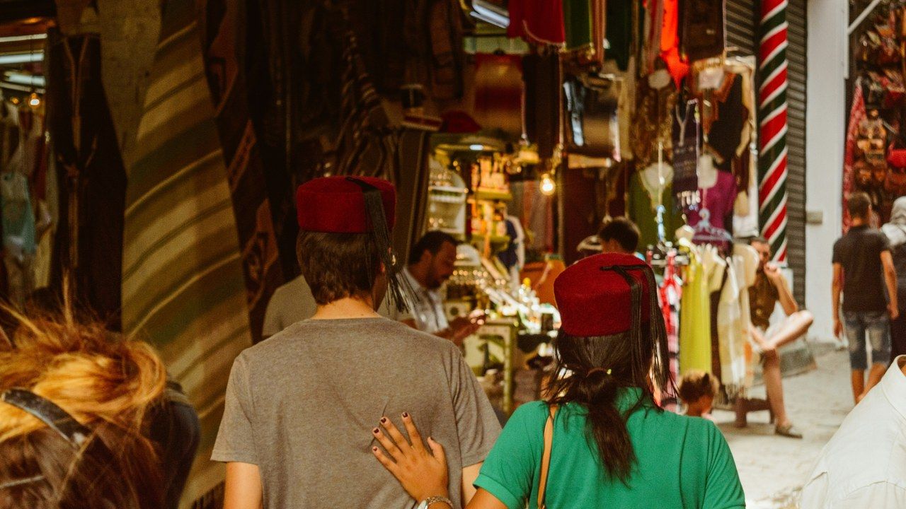 Tourists walking through the historic Medina of Tunis market in Tunisia