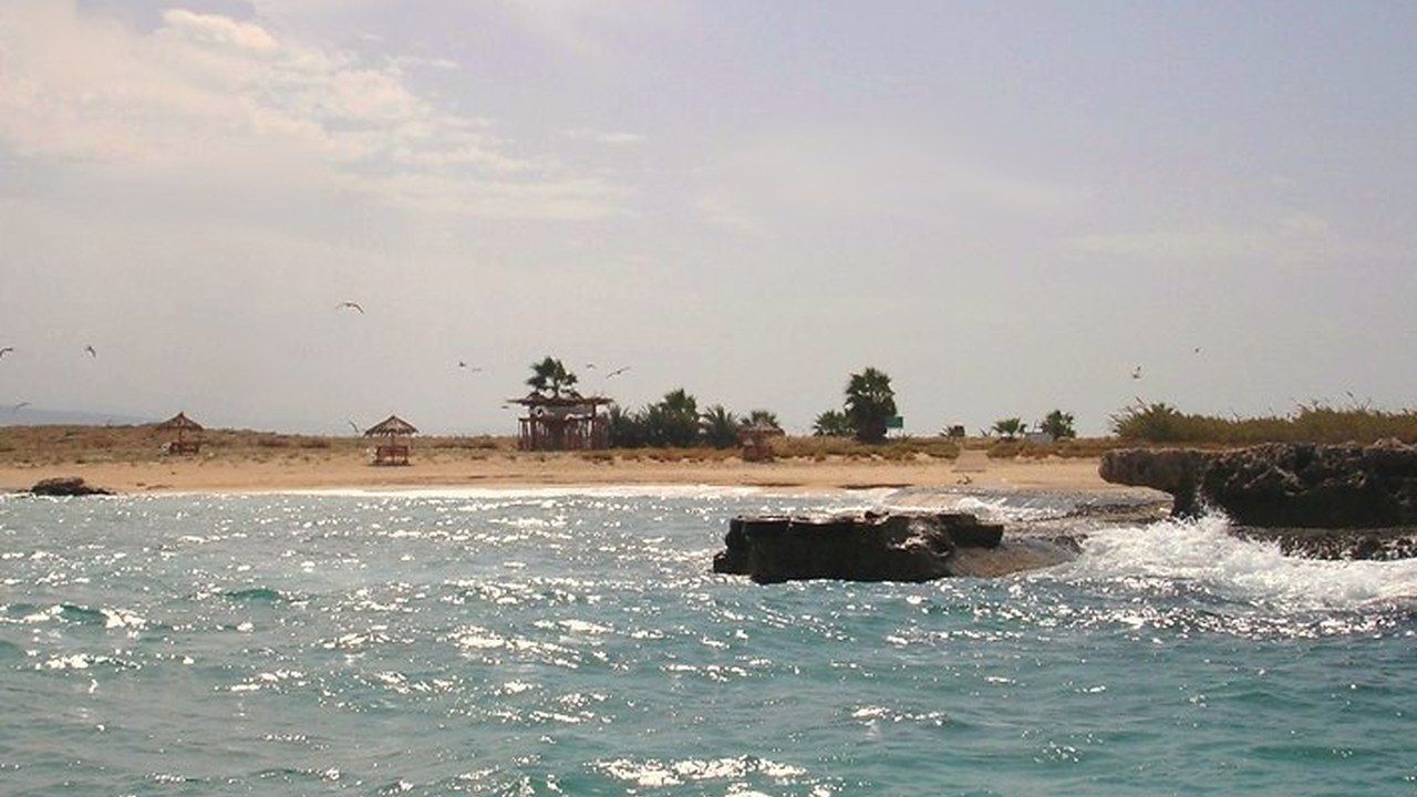 Turquoise water and rocky shoreline at Palm Islands Nature Reserve near Tripoli, Lebanon