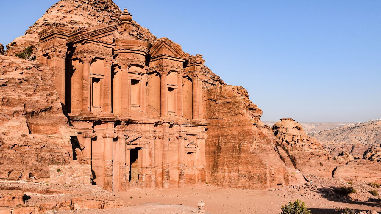 Petra Wide view of the Monastery carved into rose-red sandstone at Petra, Jordan Al Khazneh carved into rose red sandstone cliffs in Jordan