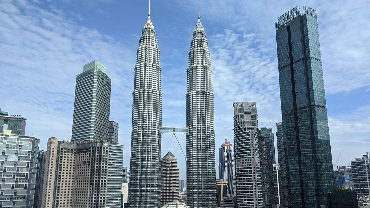 Panoramic view of the Petronas Twin Towers and Kuala Lumpur City Centre skyline in Malaysia