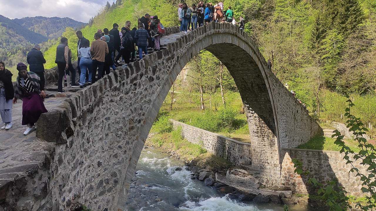 Historic arched Senyuva stone bridge crossing the Firtina River in Rize